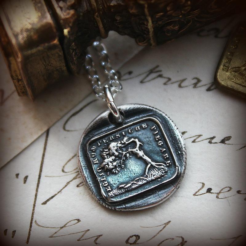 The oak and the reed wax seal necklace on antique parchment.