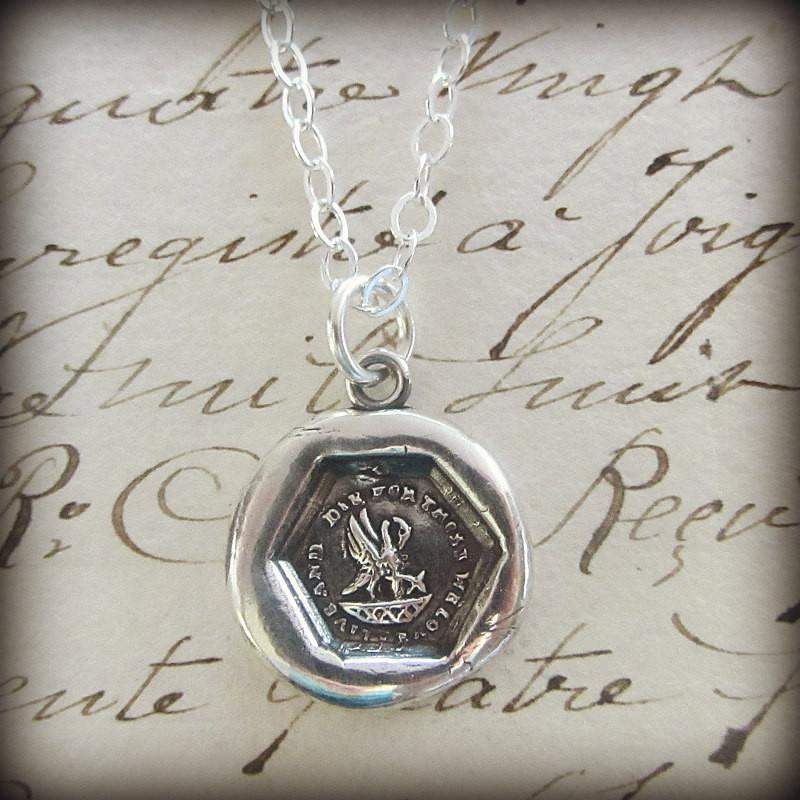 New Mommy Wax Seal Necklace over old english script.