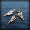 Three angel wing charms