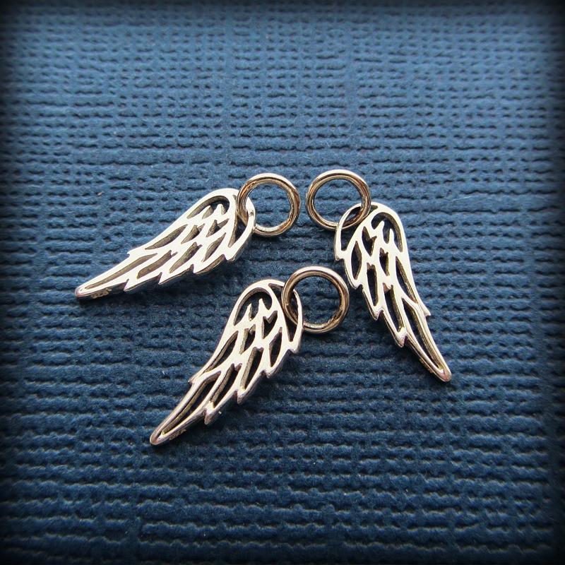 Three angel wing charms 