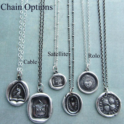 An anchor Wax Seal Necklace surrounded by a collection of wax seal necklaces to show the chain options.