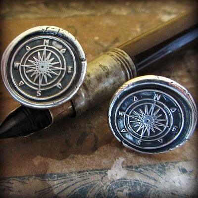 Compass Cuff Links on a marble background