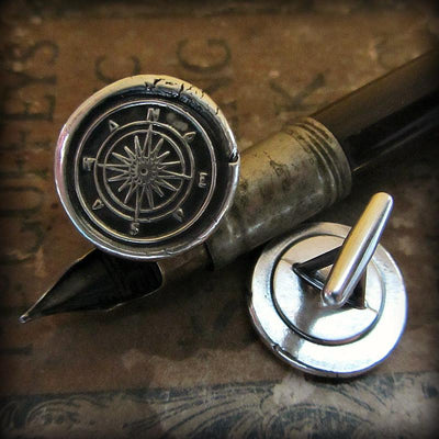 Compass Cuff Links on a fine tipped antique pen