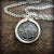 Compass wax seal necklace with silver chain.