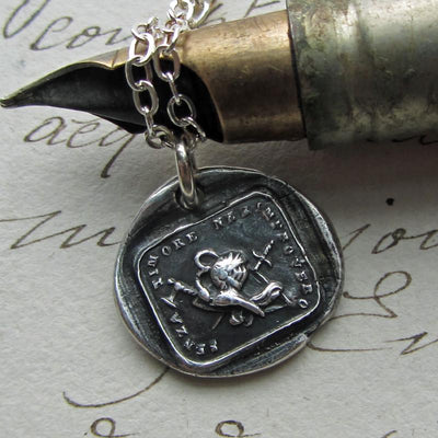 Courage Wax Seal necklace on fine tipped pen