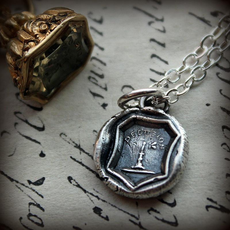 Delusion wax seal necklace with silver chain.