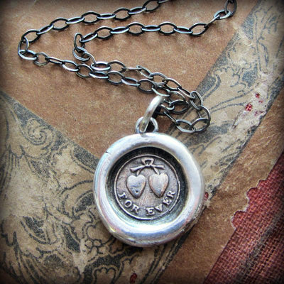 Forever Victorian Wax Seal Necklace on old english parchment paper