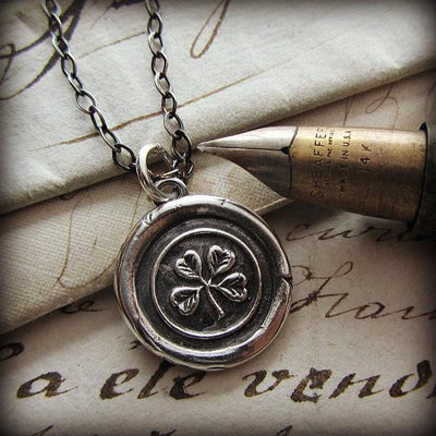 Four Leaf Clover Wax Seal Necklace with fine tipped pen.