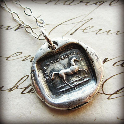 Horse wax seal with the phrase High Spirited But Sensible around it